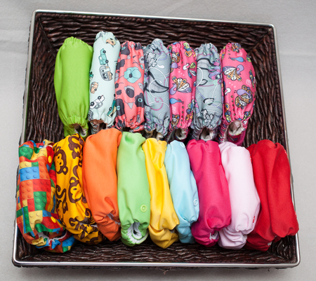 A lot of eco cloth diapers in the basketの写真素材