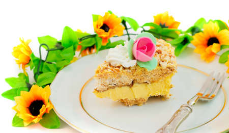 piece of birthday cake with flowers and rosesの写真素材