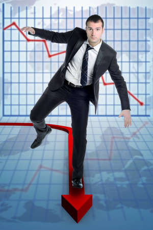 boy balancing on a background with an arrow on a graph of statisticsの写真素材