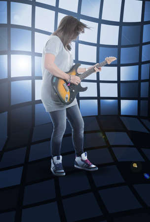 beautiful girl who plays the electric guitar rockの写真素材