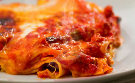 delicious hot lasagna with artichokes on a wooden backgroundの写真素材
