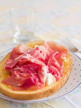 delicious bruschetta with Parma ham, salami and mozzarella Neapolitanの写真素材