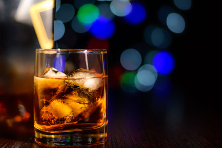 Glass of whiskey with ice