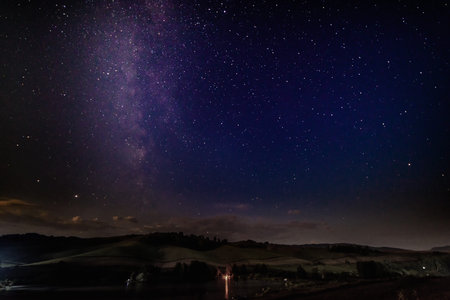 Night landscape with stars, milky way. Hills in the background