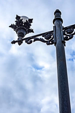 metal street lamp in the daytime against the sky, bottom viewの写真素材