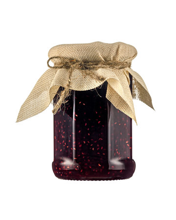 Glass jar of raspberry jam with canvas capping, tied with twine on a white background isolated