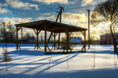 A sunny sunset. Rustic landscape on a clear winter day, sky with cloudsの写真素材