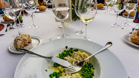 plate with food scraps and drinks with drink