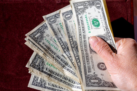hand with dollar bills