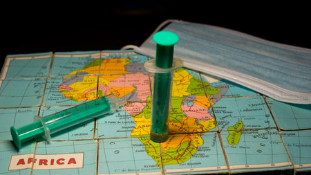 map of Africa with a syringe stuck in the south of the continentの写真素材