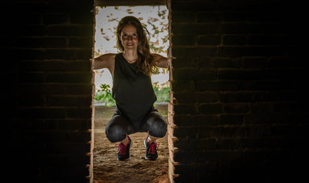 female athlete and brick door