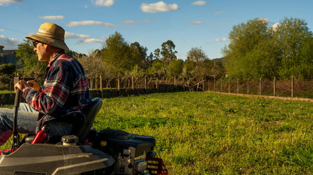 Man on riding lawn mower