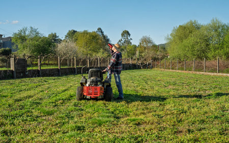 Man on riding lawn mower