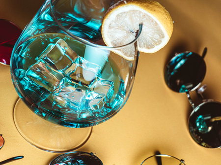 Sunglasses next to tropical cocktailの写真素材