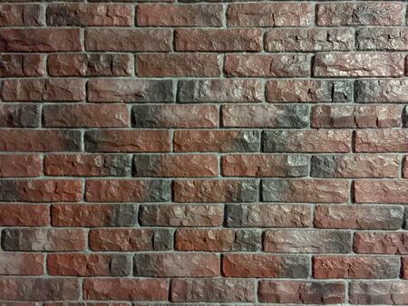 red-blue brick wall covered with glossy lacquer with embroideryの写真素材