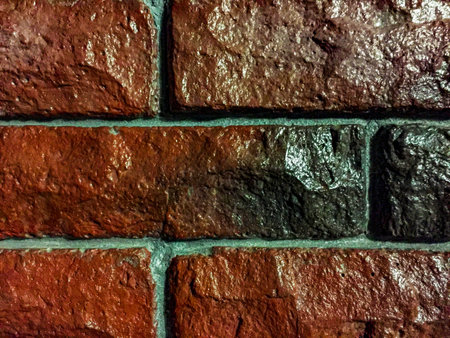brick wall covered with glossy lacquer with embroidery
