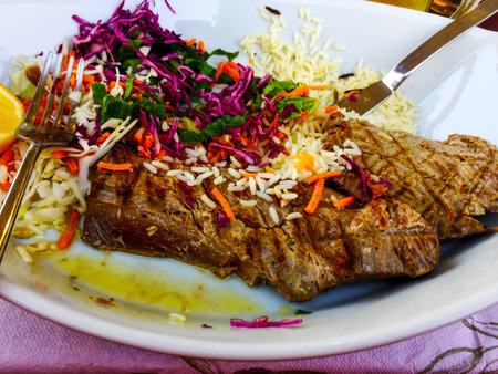 a plate of just catched fresh grilled huge tuna steakの写真素材