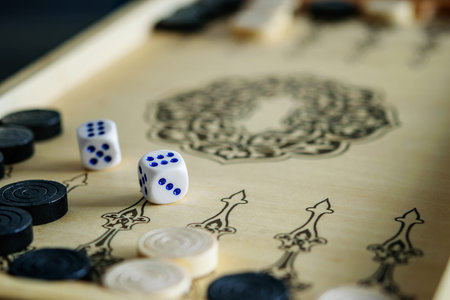 Backgammon wooden board with dices closeup. Happiness is in small things, enjoying life. 