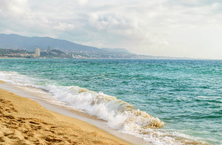 Beautiful mediterranean landscape. Sea, waves and cloudy sky. Costa Brava shore. 