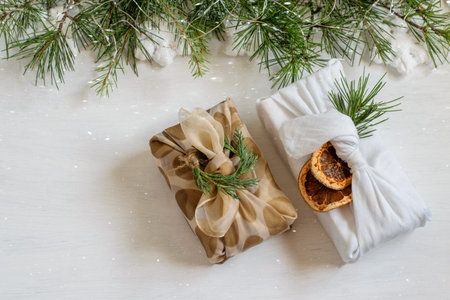 Handmade christmas gift boxes wrapped in textile cloth in japanese traditional furoshiki style. Nice...