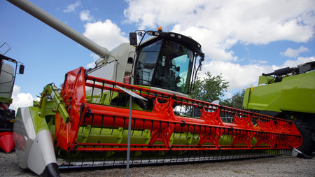 Combined harvester. Agriculture harvest machine against blue skye