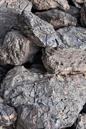 A pile of dry lignite coal ready for heating during winterの写真素材