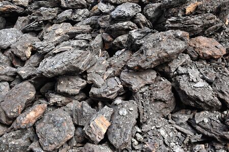 A pile of dry lignite coal ready for heating during winterの写真素材