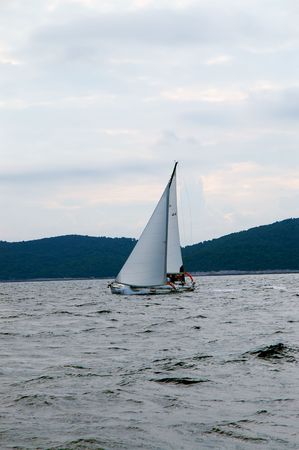 Sailing under cloudy skyの写真素材