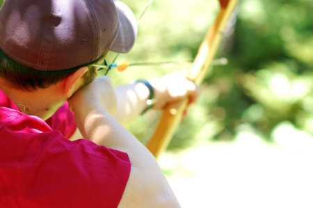 Male archer aiming at target - very thin depth of fieldの写真素材