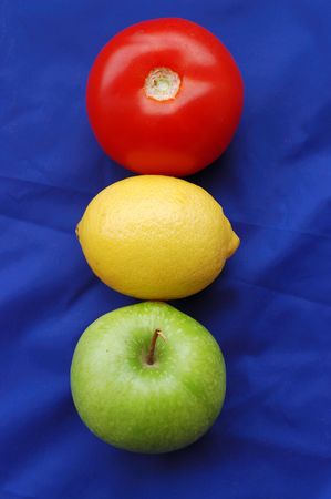 Concept of fruits representing traffic light on blue background の写真素材