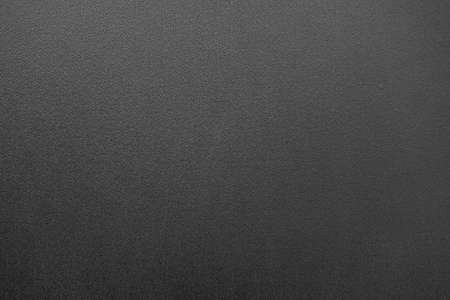 Texture of black cardboard. A sheet of black paper. Dark background for the text. Gloomy background for the ad. Black application form.の写真素材