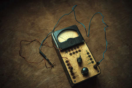 An old electrical device for measuring current strength. Vintage ammeter. Retro electricians tool.の写真素材