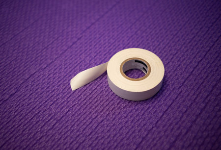 White tape on a purple background. Tape for wire insulation.の写真素材