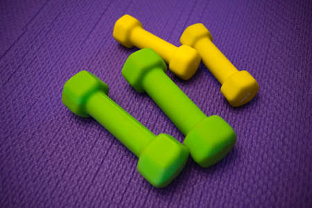 Dumbbells for sports on a soft mat in the gym.の写真素材