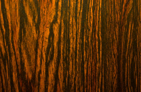 Vintage mahogany texture with vertical black stripes.Veneer for pasting edges of furniture.の写真素材