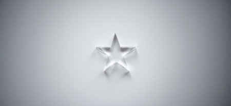 A small transparent glass star on a white background. The winners small prize. A bright star is a...