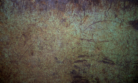 Photo of the texture of a rusty metal wall in green color.The background is made of an old sheet of iron.の写真素材