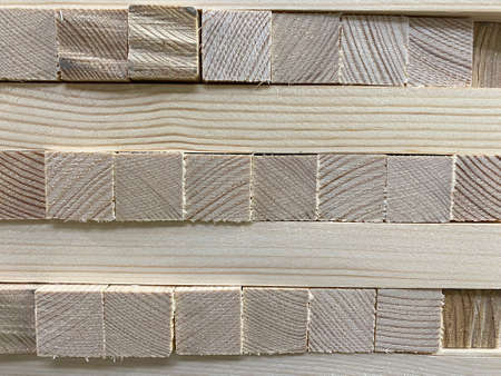 Photo of the texture of a wooden construction beam. Square wooden materials side view.の写真素材
