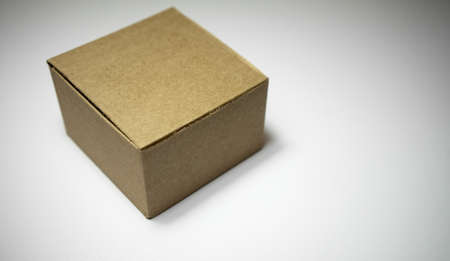Brown cardboard box on white isolate. Craft box without inscriptions.の写真素材