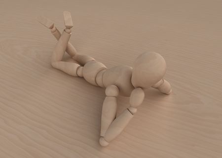Mannequin lying on woodの写真素材