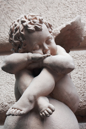 Figure of angel as a symbol of love, kindness, and sufferingの写真素材
