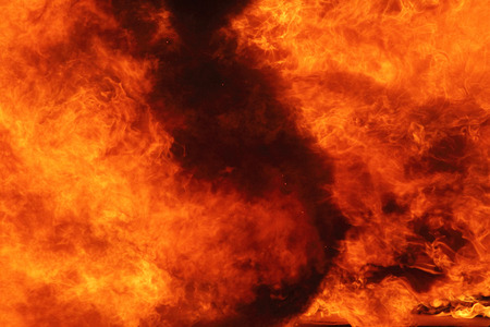 background of fire as a symbol of hell and eternal tormentの写真素材