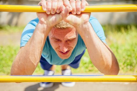 Sport, health and lifestyle concept. Young man sportler is training on the street.の写真素材