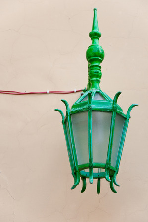 indian lamp hanging on a house wallの写真素材