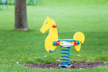 horse seasaw on a playgroundの写真素材