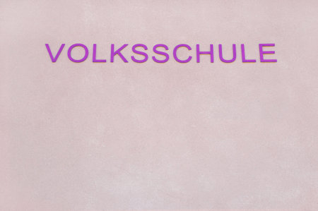 the word primary school in german written on a wall