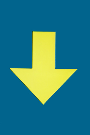 direction arrow showing downの写真素材