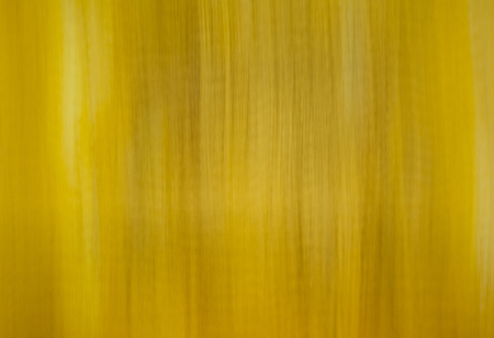 yellow acrylic painted canvas used for backgroundの写真素材