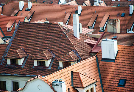 many roofs made of clay bricks fotographed from above in Prague - Czech Republicの写真素材