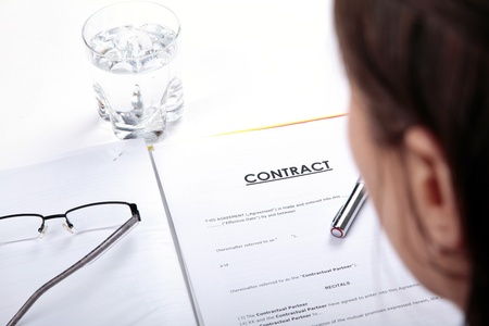 woman reading contract termsの写真素材